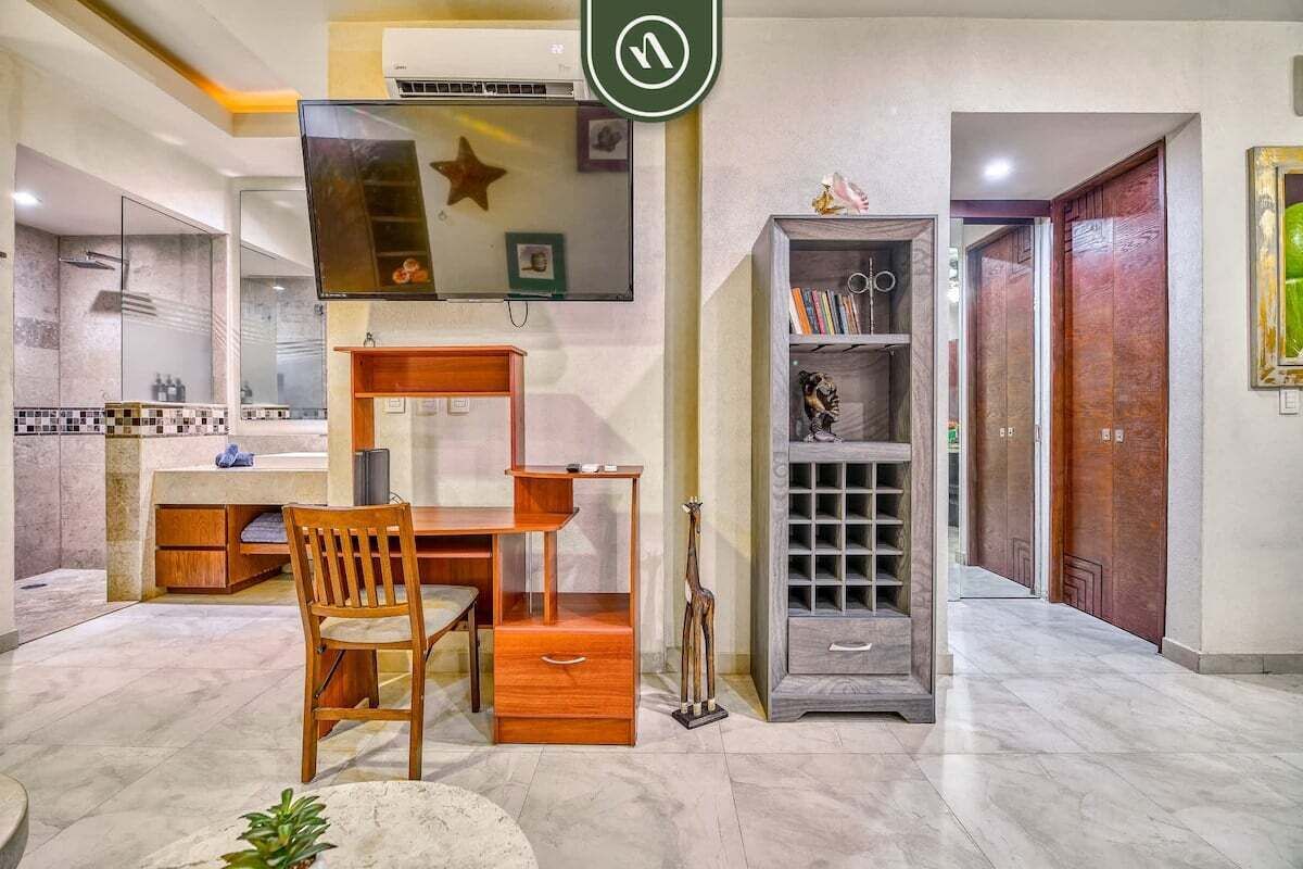 A modern bathroom with a shower, a vanity, and a toilet.