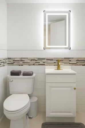 Shower, towels, soap, toilet paper