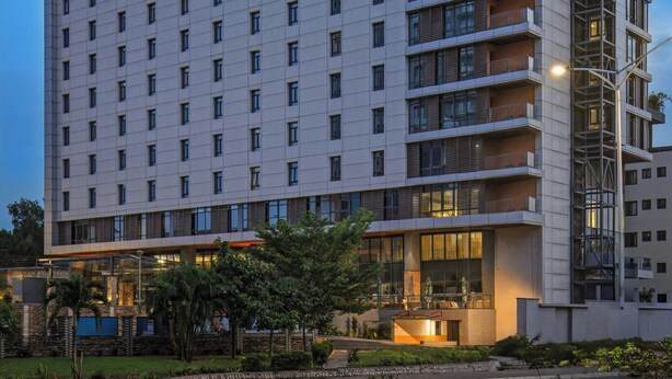A multi-story hotel with a modern design, featuring balconies on each floor and a prominent signage at the top. - Four Points® by Sheraton Accra Airport Hotel (Accra)