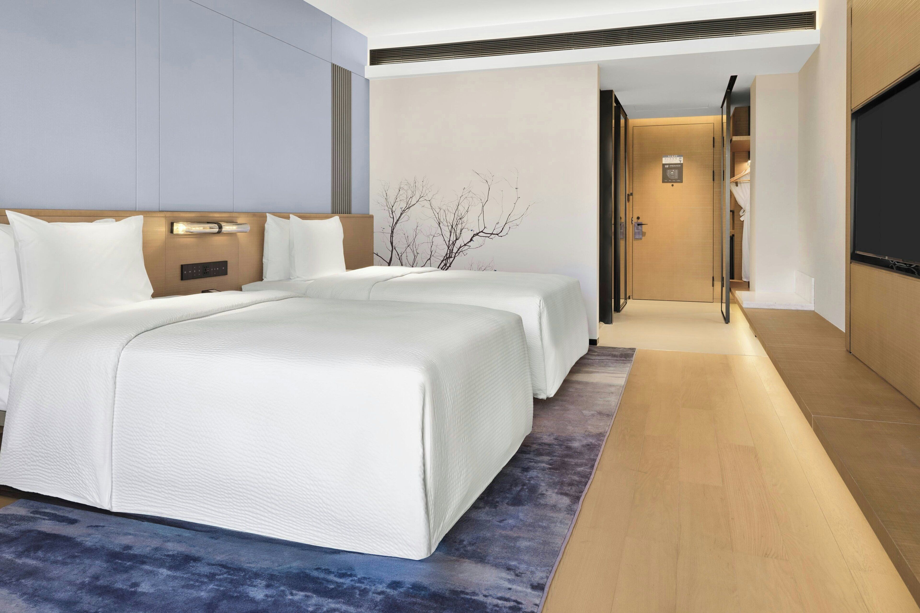 Twin Room, 2 Double Beds, City View | Down duvets, pillow-top beds, free minibar, in-room safe