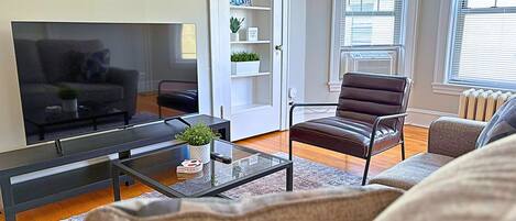 Comfort Apartment, 1 Queen Bed | Living area | 55-inch TV with digital channels, streaming services