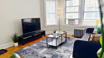 Comfort Apartment, 1 King Bed | Living area | 55-inch TV with digital channels, streaming services