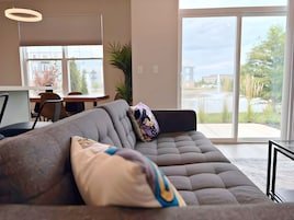 Family Apartment, 4 Bedrooms, Patio, Lake View | Living area | 55-inch TV with digital channels, streaming services