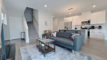 Family Apartment, 4 Bedrooms, Patio, Lake View | Living area | 55-inch TV with digital channels, streaming services