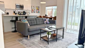 Family Apartment, 4 Bedrooms, Patio, Lake View | Living area | 55-inch TV with digital channels, streaming services