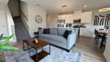 Premier Apartment, Patio, Lake View | Living area | 55-inch TV with digital channels, streaming services
