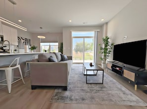 Premier Apartment, Patio, Lake View | Living area | 55-inch TV with digital channels, streaming services