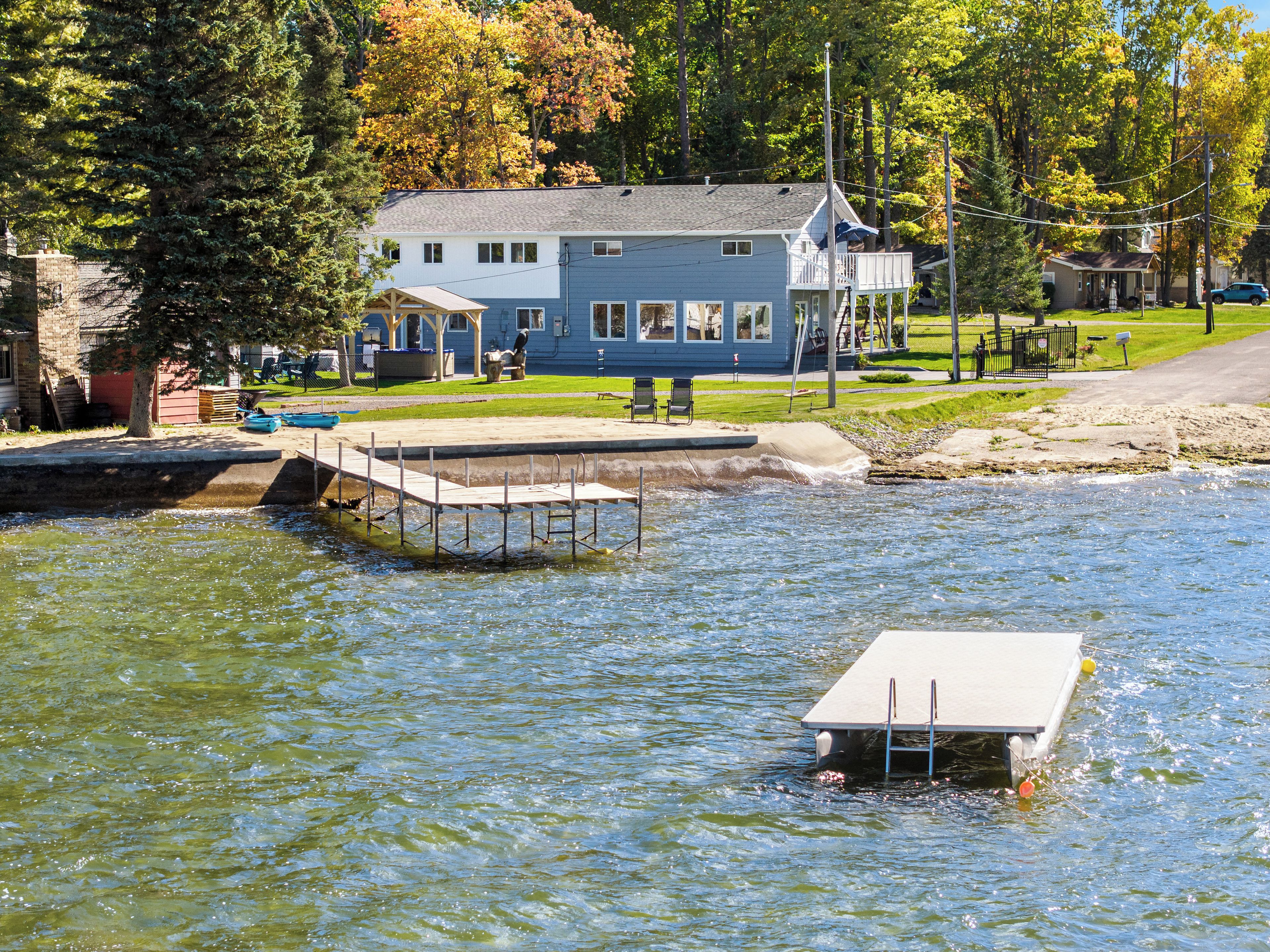 Lakefront retreat with private dock, yard, and beautiful water views