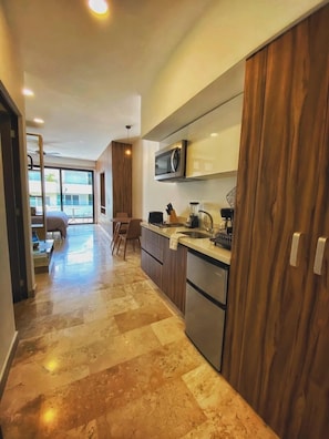 Fridge, microwave, stovetop, coffee/tea maker