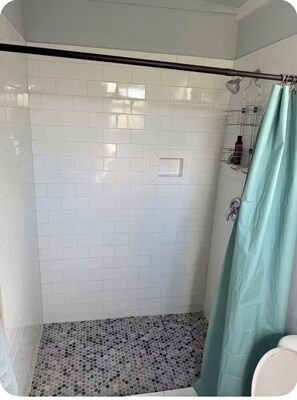 Shower, towels, soap, toilet paper