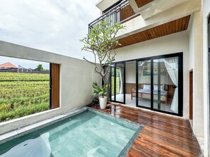 A modern villa with a swimming pool, wooden flooring, and a balcony overlooking a rice field. - Athaya Canggu Villas by Nagisa Bali (Canggu)