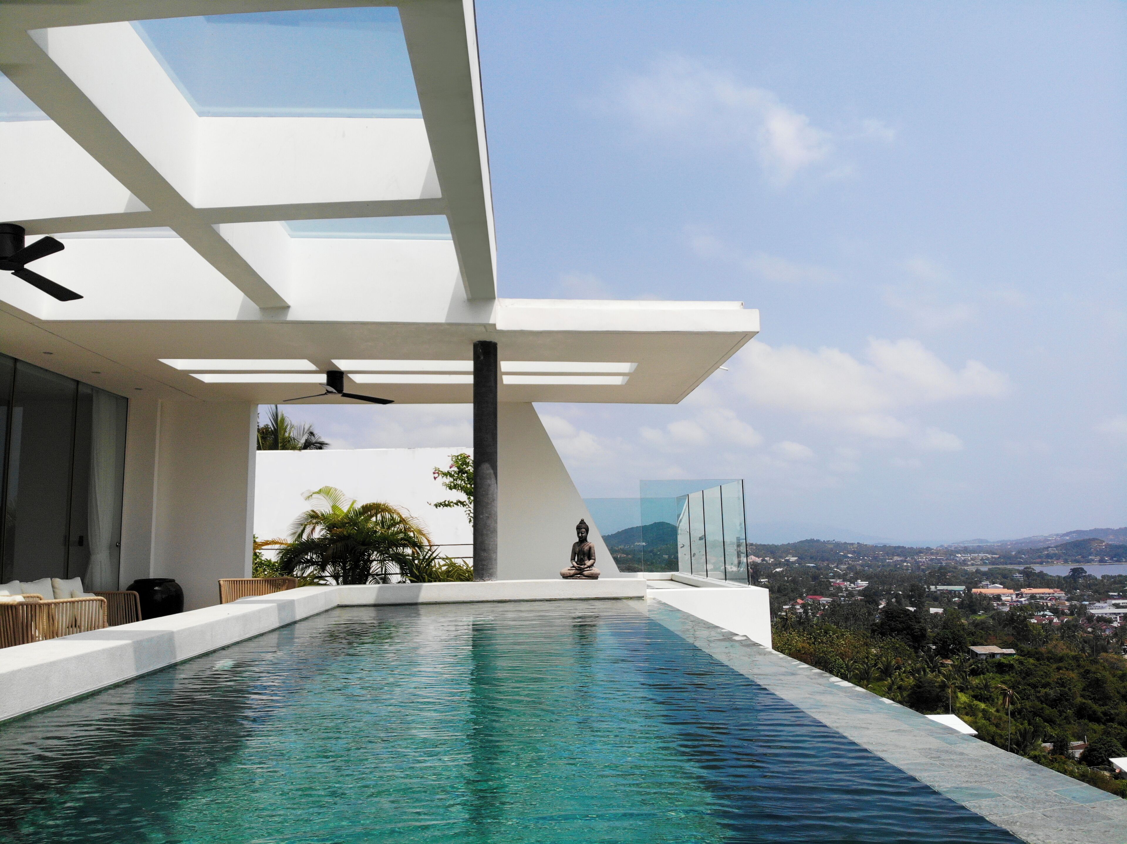 A modern infinity pool with a clear view of the cityscape.