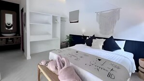 A modern hotel room with a large bed, a bedside table, a wall-mounted TV, and a white wardrobe. - Villa Bohème, Villa 28 (Koh Samui)