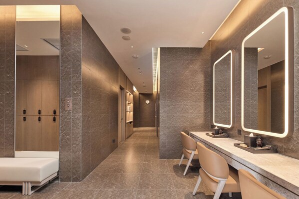 A modern bathroom with a vanity, mirrors, and a shower area. - Shilla Monogram Xi'an (Xi'an)