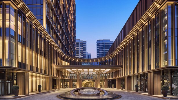 A modern hotel with a central courtyard, large windows, and a symmetrical facade. - Shilla Monogram Xi'an (Xi'an)