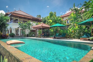 Outdoor pool, open 8:00 AM to 9:00 PM, free cabanas, pool umbrellas