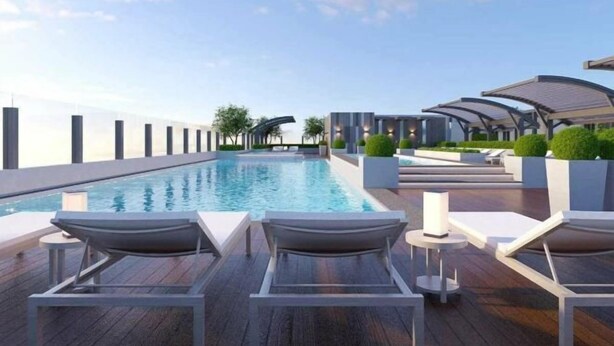 A rooftop pool area with lounge chairs and a clear view of the sky. - Bap's House - CSJ Apartment Vung Tau (Vung Tau)