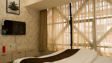 Desk, laptop workspace, blackout curtains, free WiFi