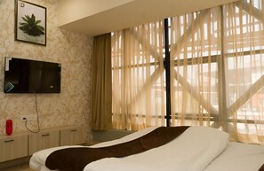 Desk, laptop workspace, blackout curtains, free WiFi
