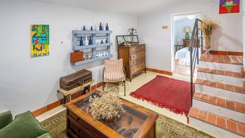 Deluxe tweepersoonskamer, uitzicht op tuin | Woonruimte