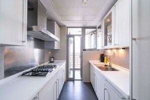 Superior Apartment, 3 Bedrooms, Kitchen, City View | Private kitchen | Dining tables