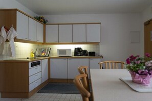 Fridge, microwave, stovetop, coffee/tea maker