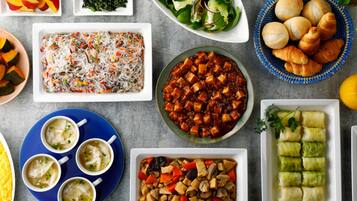 A variety of dishes including a salad, soup, and a casserole.