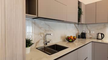 Comfort Apartment | Private kitchen | Full-sized fridge, microwave, oven, stovetop