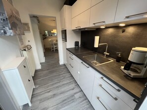 Fridge, microwave, stovetop, coffee/tea maker