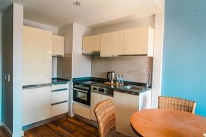 Condo, Sea View | Private kitchen | Full-size fridge, oven, stovetop, dishwasher