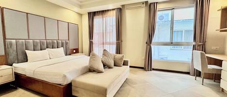 Standard Double Room, City View | In-room safe, desk, laptop workspace, iron/ironing board