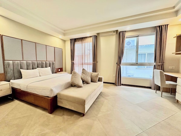 Standard Double Room, City View | In-room safe, desk, laptop workspace, iron/ironing board