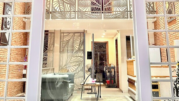 A storefront with a neon sign reading "Premier Laguna." - LAGUNA Premier Hotel (Ho Chi Minh City)