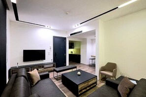Family Apartment | Living area | 42-inch LED TV with satellite channels