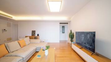 Superior Apartment, 3 Bedrooms, Balcony, City View | Living room | 55-inch Smart TV with cable channels