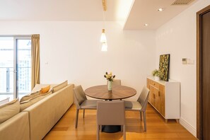 Superior Apartment, 3 Bedrooms, Balcony, City View | Living room | 55-inch Smart TV with cable channels