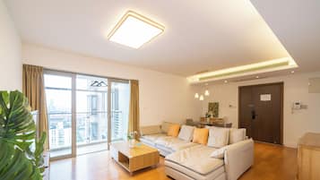 Superior Apartment, 3 Bedrooms, Balcony, City View | Living room | 55-inch Smart TV with cable channels