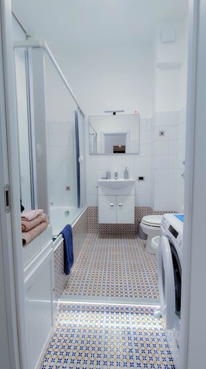 Hair dryer, bidet, towels, soap