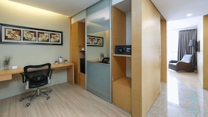A modern office space with a desk, office chair, and shelving units. - Empire Suite Subang by MyKey (Subang Jaya)