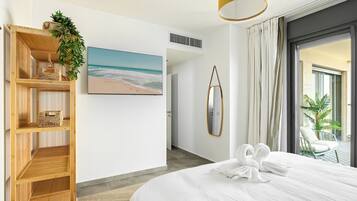 Apartamento, vista para a praia | Ferros/tábuas de passar roupa, Wi-Fi de cortesia