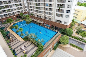 Outdoor pool, open 6:00 AM to 9:00 PM, pool umbrellas, pool loungers