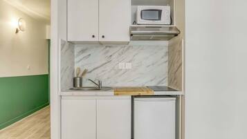Microwave, stovetop, coffee/tea maker, cookware/dishes/utensils