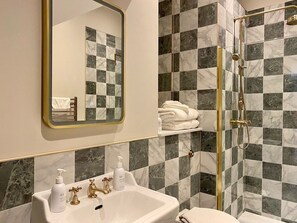 Shower, hair dryer, soap, toilet paper