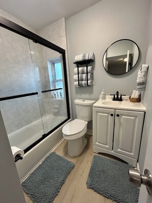 Shower, hair dryer, towels, soap