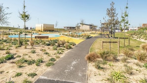 A pathway leading to a pool area with a building in the background. - Marine Court First-floor Double Bedroom With Bathroom (Littlehampton)