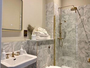 Shower, hair dryer, towels, soap