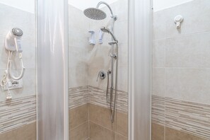 Shower, hair dryer, towels