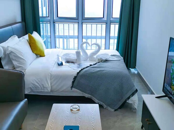 Desk, laptop workspace, blackout curtains, iron/ironing board