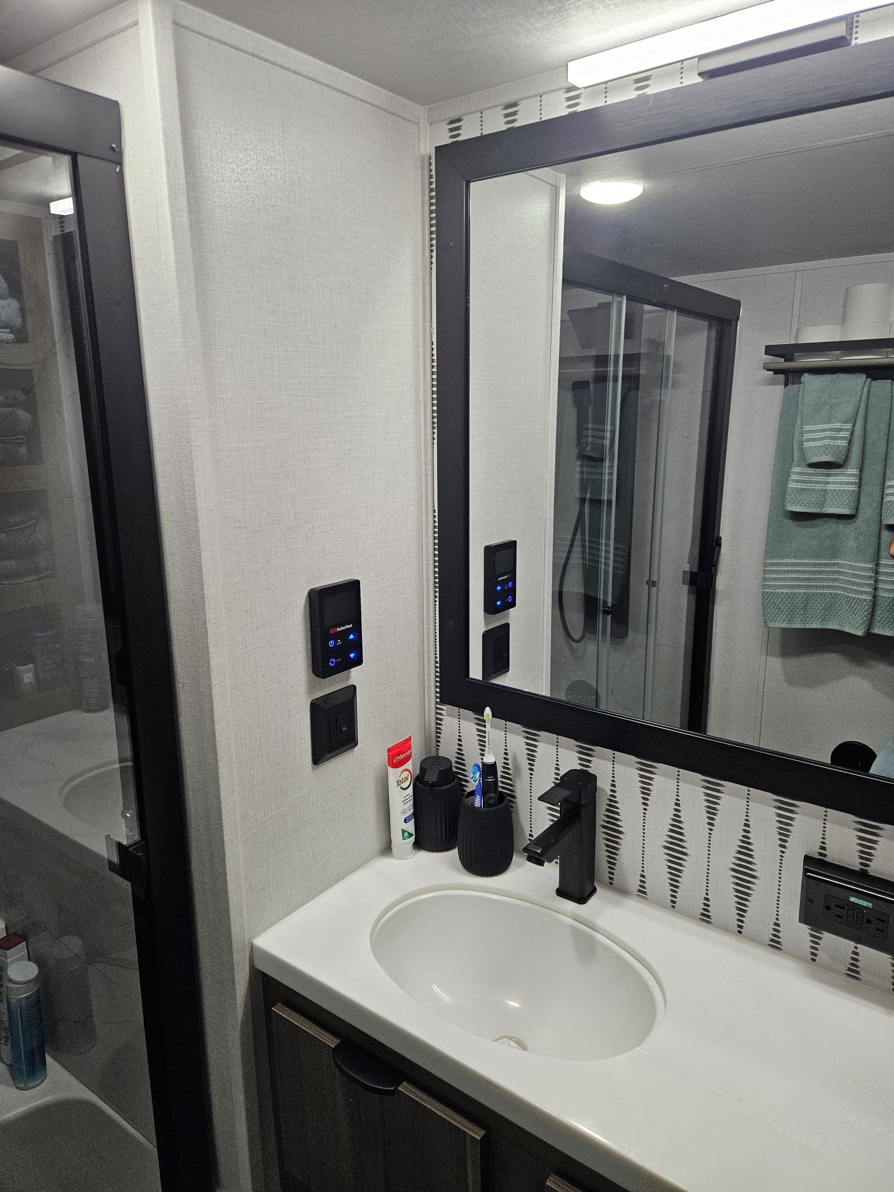 Shower, towels, soap, toilet paper