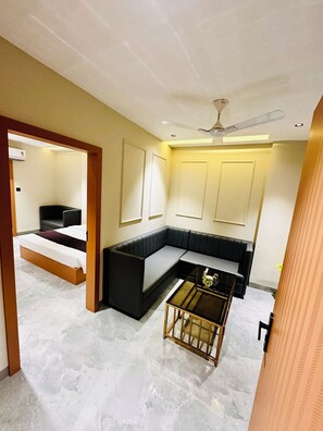 Quarto casal superior | Área de estar